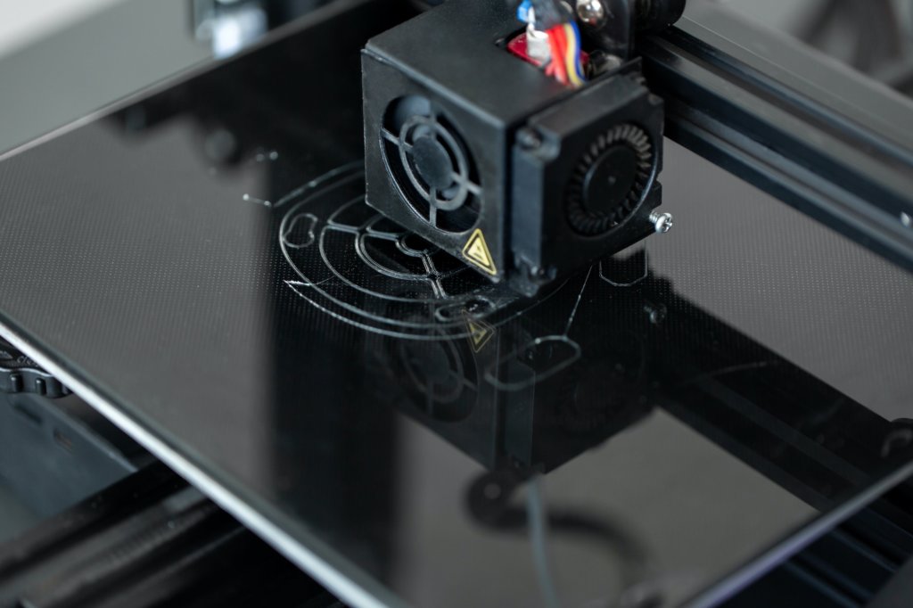 Electronic three dimensional plastic 3D printer during work in laboratory