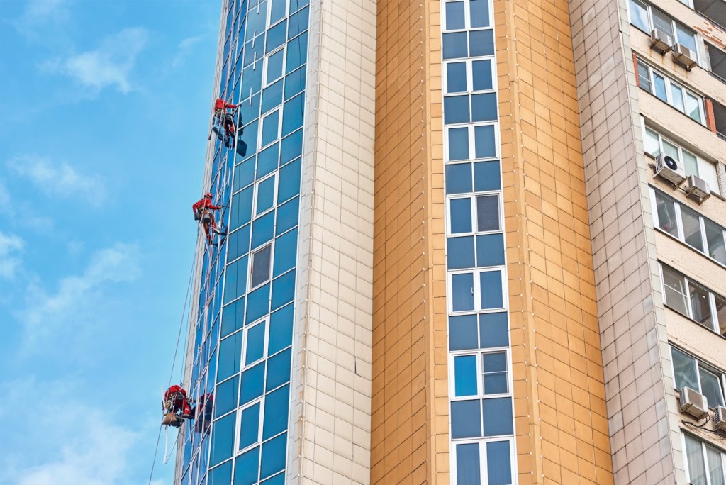 Group of industrial climber work on a modern building outdoor